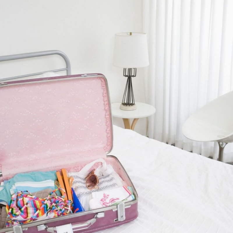 Packed suitcase in bedroom