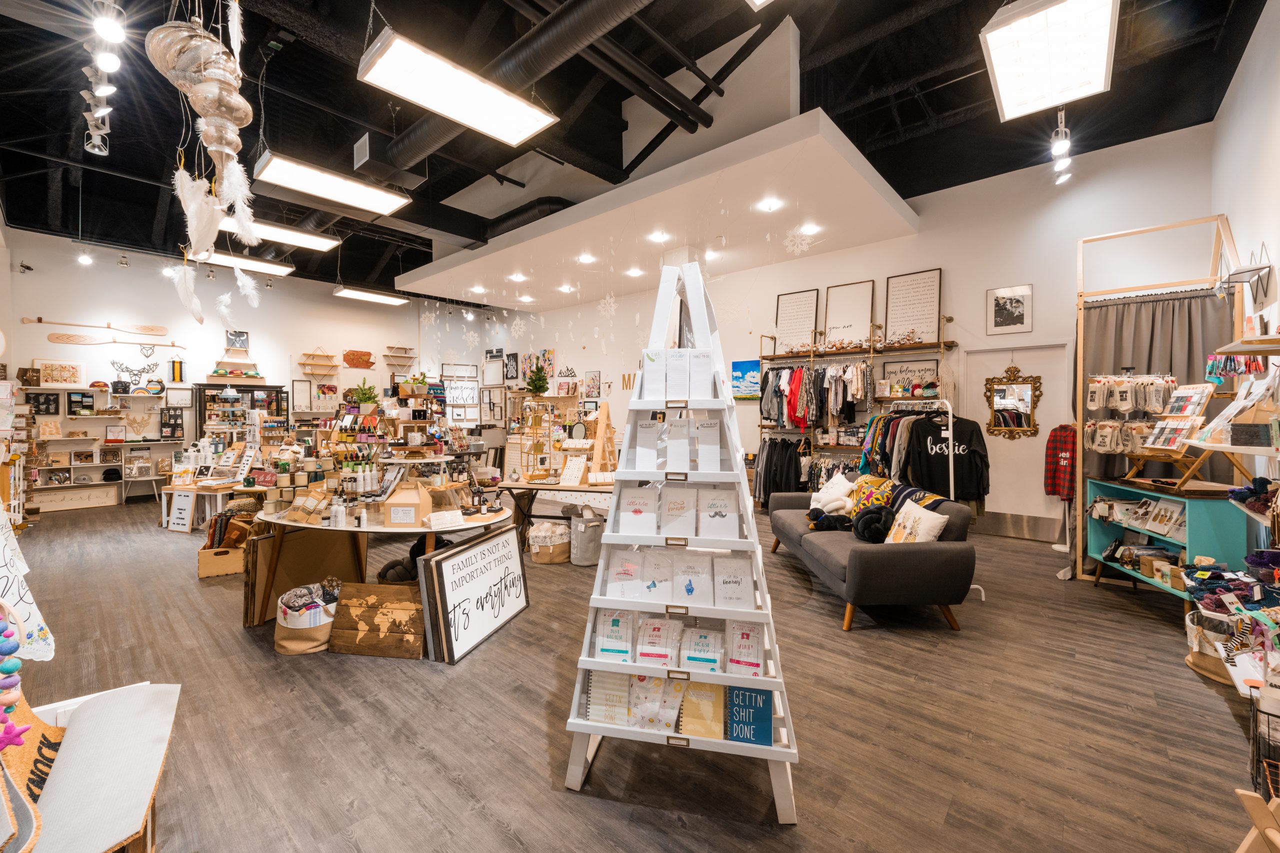 Inside of a store with cards, apparel, art