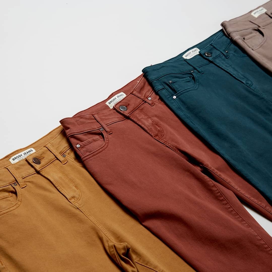 Row of fall coloured mens pants