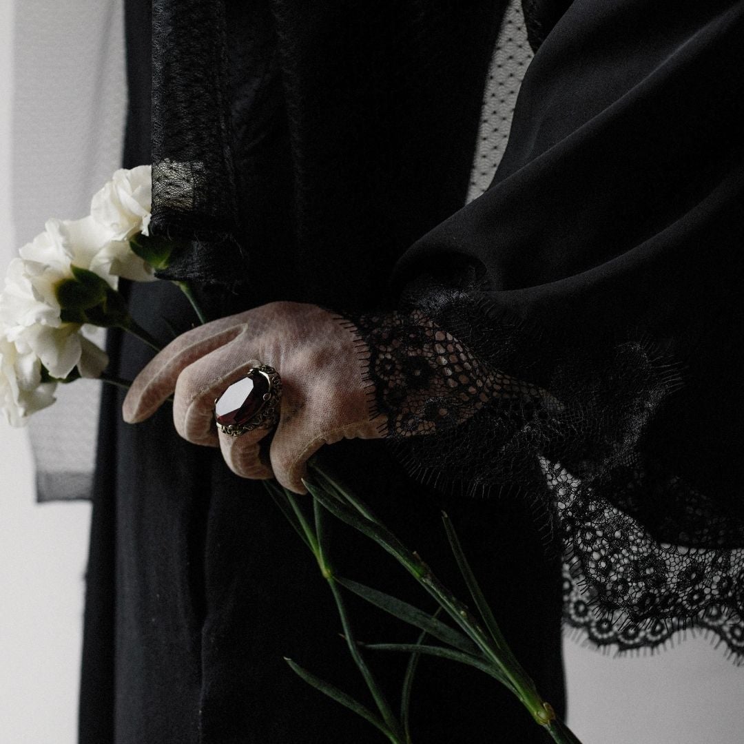 Black dress with lace and a black ring